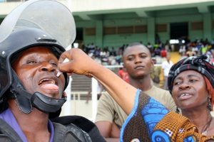 Kinshasa, March 2011: While waiting until the National Football Team is ready to get vaccinated against polio, a security officer takes his chance UNICEF/C. Walther